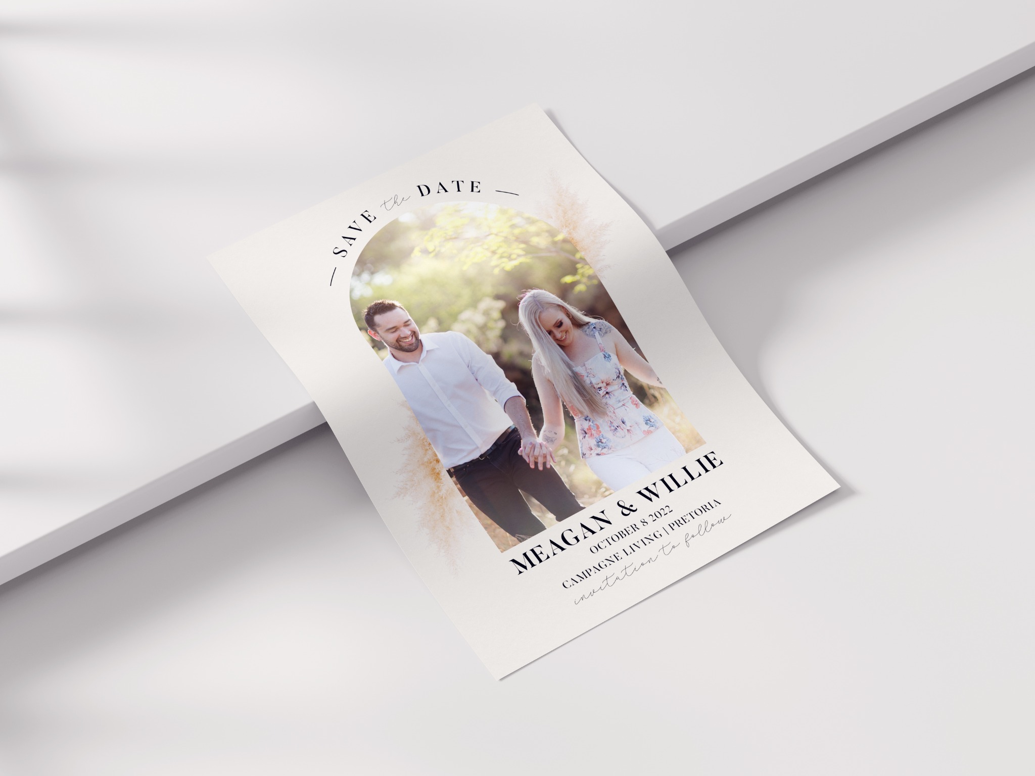 Meagan and Willie save-the-date card with photograph